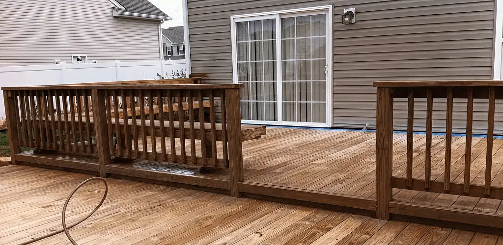 Deck sealing service protecting a backyard wood deck and railings in Salt Lake City, UT