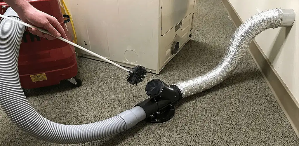 Dryer vent cleaning service removing lint from a dryer duct connection in Salt Lake City, UT