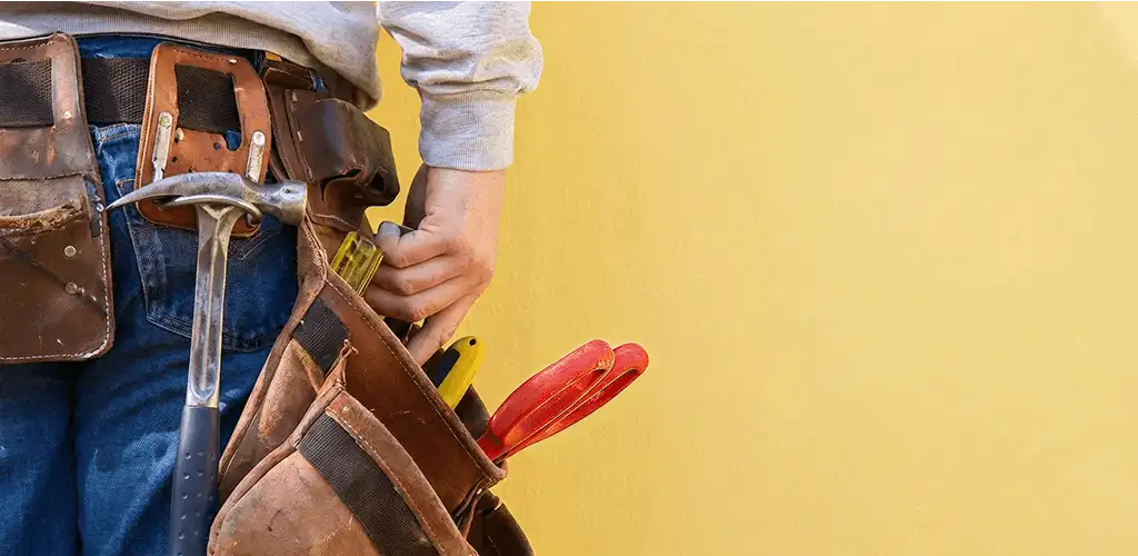 Handyman with tool belt ready for home repairs and maintenance in Salt Lake City, UT