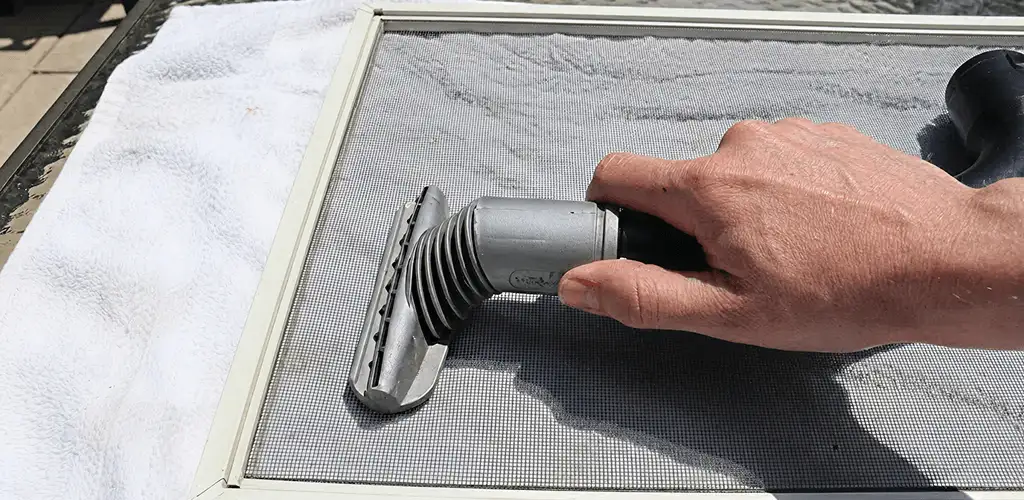 Window screen repair cleaning and fixing a damaged screen mesh in Salt Lake City, UT